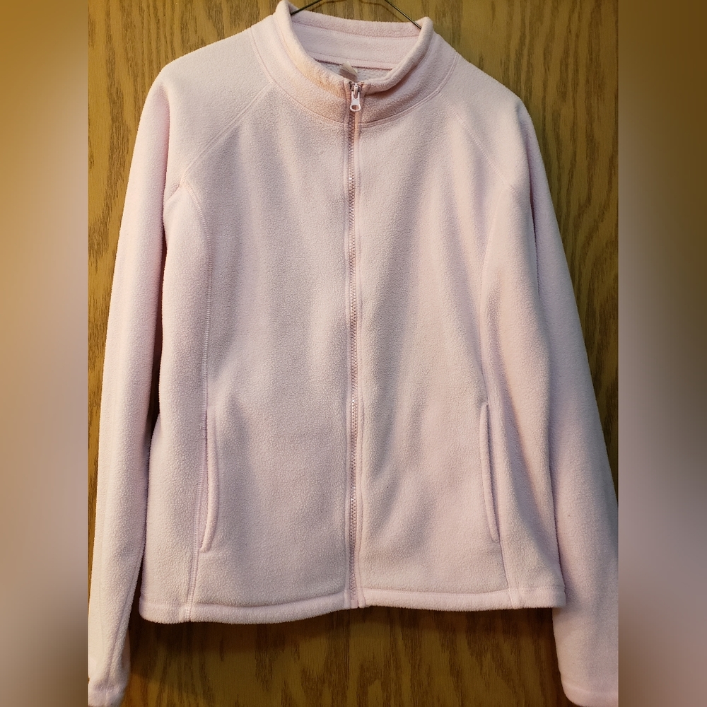 Cute, soft, light pink zip up light jacket with front pockets. Size small
